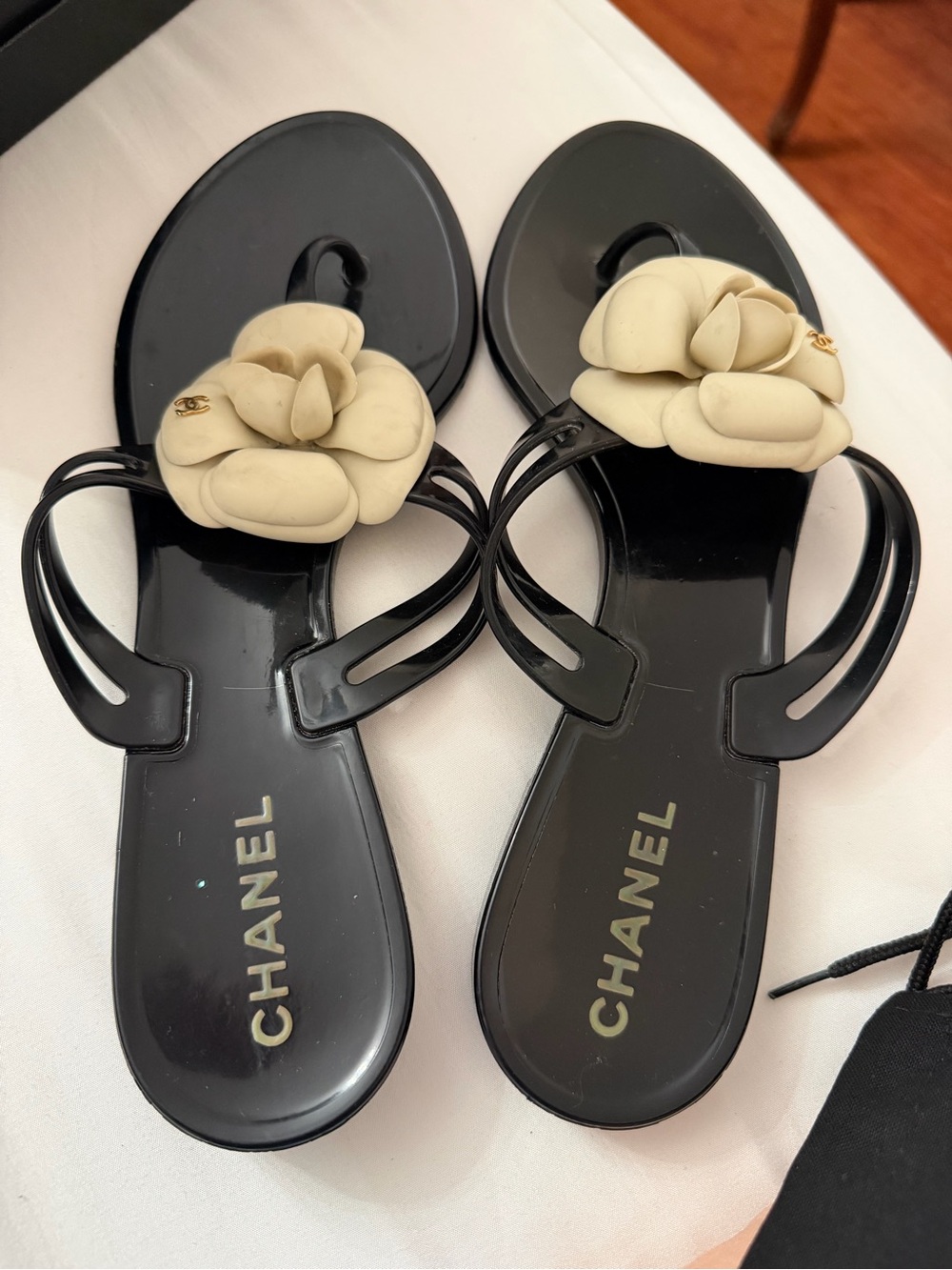 CHANEL Black Jelly Thong Sandals with Cream Camellia